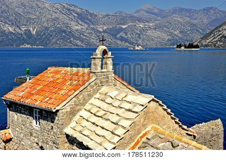 Old church and islands of bay of Kotor and Risan in Montenegro