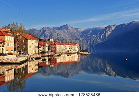 Amazing landscape with reflection of houses in the sea. Bay of Kotor and Risan Montenegro