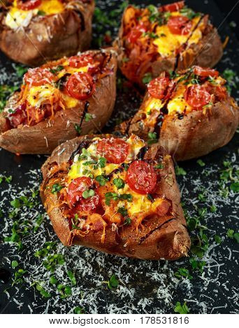 hot baked sweet potato stuffed with bacon, cheddar cheese, cherry tomatoes, balsamic vinegar, cress salad and parmesan sprinkle. Tacco, burrito style