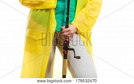 Person Holding Fishing Rod, Spinning Equipment.