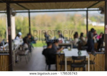 Blurred or Defocus image of open air restaurant or Cafeteria for use as Background.