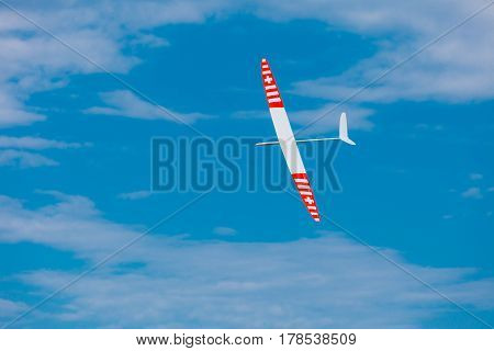 RC remotely controlled soaring plane model sailplane on blue sky in brisk wind