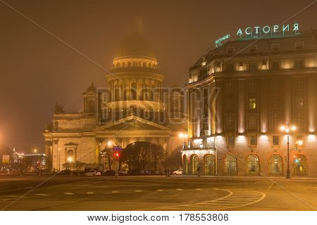 SAINT PETERSBURG, RUSSIA - MARCH 12, 2017: St. Isaac's Cathedral and Astoria hotel foggy March night
