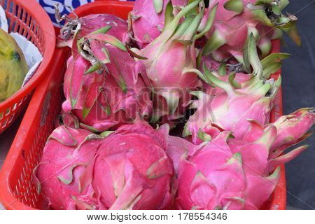 Fruit with a peel of brightly pink or red color, smooth with leaf outgrowths.