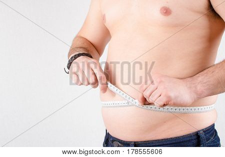 fat guy With Measuring Tape isolated on white background