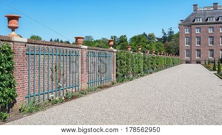 Apeldoorn The Netherlands May 8 2016: Dutch baroque garden of The Loo Palace a former royal palace and now a national museum located in the outskirts of Apeldoorn in the Netherlands