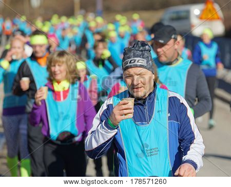 STOCKHOLM SWEDEN - MAR 25 2017: Group of runners drinking water in the Stockholm Tunnel Run Citybanan 2017. March 25 2017 in Stockholm Sweden