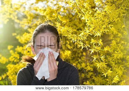 Girl With Allergic Reaction On Blooming Tree