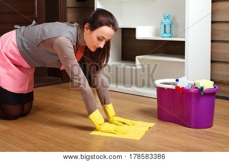 Cleaning servisce worker wash the floor with rag