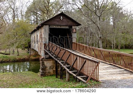 Childersburg Alabama USA - March 25 2017: Kymulga Covered Bridge spanning Talladega Creek. One of two surviving original covered bridges from the Civil War in eastern Alabama.