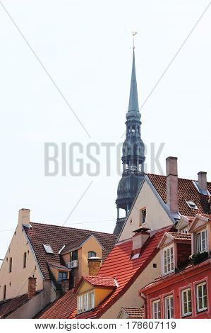 View on Bell tower of St. Peter cathedral in Vecriga and old houses Riga Latvia