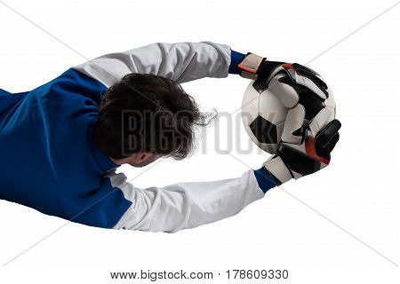 Goalkeeper catches the ball during a football game