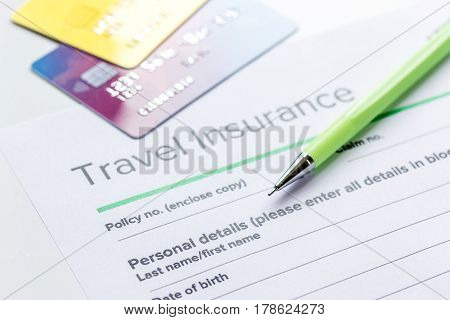 booking travel concept with insurance form and credit cards on white table background