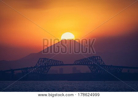 Diamond Fuji View of the setting sun meeting the summit of Mt. Fuji
