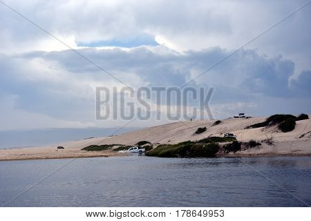 Crokers creek with sand dunes in the background (Belmont - Nine Miles - Beach NSW Australia).