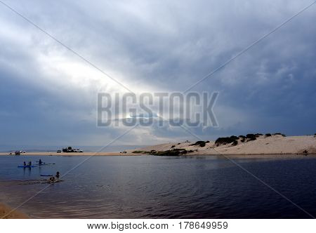 Crokers creek with sand dunes in the background (Belmont - Nine Miles - Beach NSW Australia).