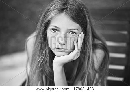 Girl teenager sitting in a chair sensual
