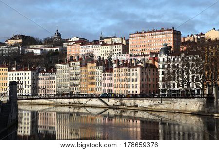 Lyon, France - December 20, 2016: houses on Embankment and bridge St. Vincent. River Saone (Sona) in December 20 2016 in Lyon, France