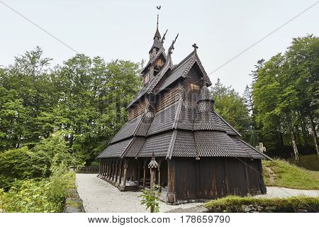 Norwegian graveyard and stave church roof. Fantoft. Bergen. Visit Norway