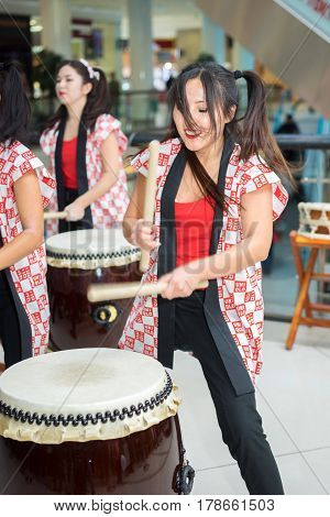 Moscow, Russia - March 25, 2017: Group Of Japanese Taiko Drummers Girls Perform In Kaleidoscope Shop