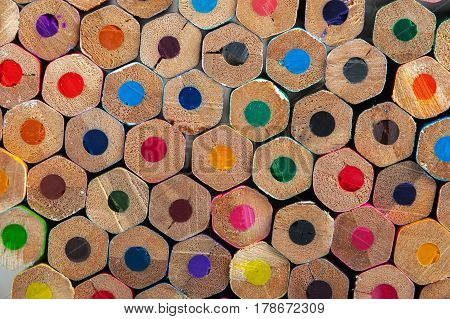 Colorful pencils background. Assortment of unsharpened multicolored crayons, macro view.