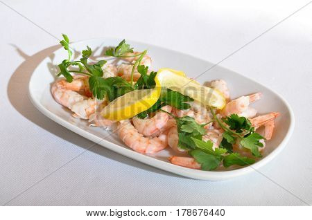 Boiled and peeled fresh delicious shrimp in white plate