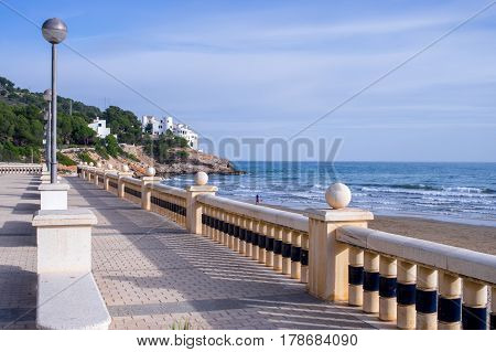 Walking along the seashore in Siges, BArcelona, Spain