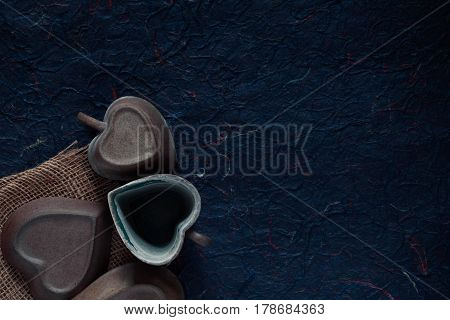 Old ceramic cup on a blue background.