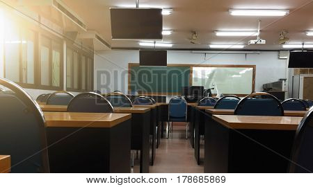 School classroom with school desks and blackboard in university