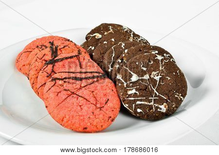 Various and delicious cookies in white plate