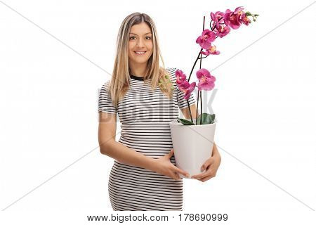 Young woman holding an orchid flower in a pot isolated on white background