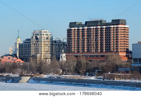 View of "President hotel" in the downtown Crimean embankment and park "Muzeon" residential and office buildings the orthodox church and belfry on sunny winter day