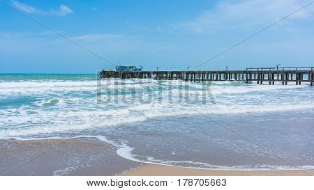 Pier in beautiful Mae Rumphueng Beach in Rayong , Thailand