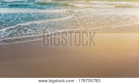 Waves at Mae Rumphueng Beach , Rayong , Thailand using split toning and increasing warm light