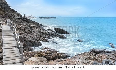 Wooden walkway along the coastline to peninsula at Khao Laem Ya National Park Rayong Thailand