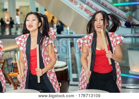 Moscow, Russia - March 25, 2017: Group Of Japanese Taiko Drummers Girls Perform In Kaleidoscope Shop