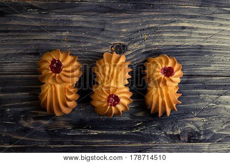 Cookies kurabe on a wooden table in a rustic style.