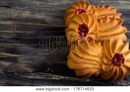 Cookies kurabe on a wooden table in a rustic style.