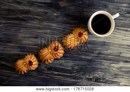 Cookies kurabe on a wooden table in a rustic style.