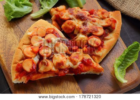 Pizza is Italain food with cheese on sausage.