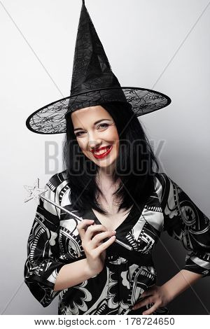 Funny Witch. Young happy woman with canival hat.