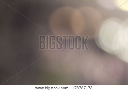 Blurred and defocused abstract background with soft multicolored bokeh circles overlay concept