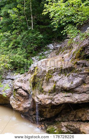Waterfall is on the mountain river . Krasnodar region Russia.
