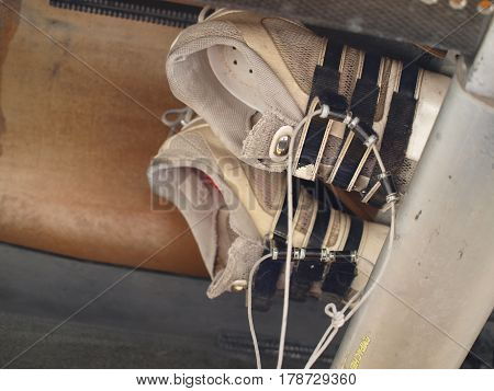 Rowing shoes on sliding board mount remain when vessel is loaded onto the trailer for transport.