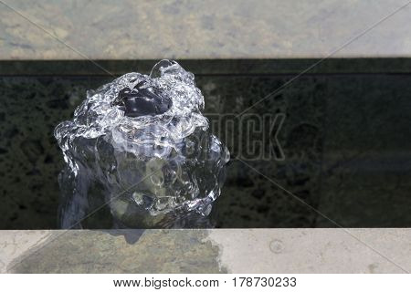 water fountain in park on marbel close-up