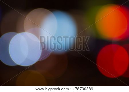 Blurred and defocused abstract background with soft multicolored bokeh circles overlay concept