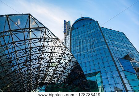 SAMARA RUSSIA - MARCH 25 2017: The modern building of the Samara Rail Terminal against the blue sky. The station was built in 2001 height with a spire is 101 meter