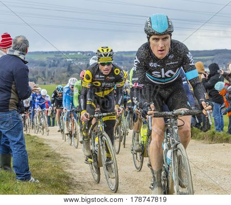 VendomeFrance- March 72016:The French cyclist Sylvain Chavanel of Direct Energie Team riding in the peloton on a dirty roadTertre de la Motte in Vendome during the first stage of Paris-Nice 2016.