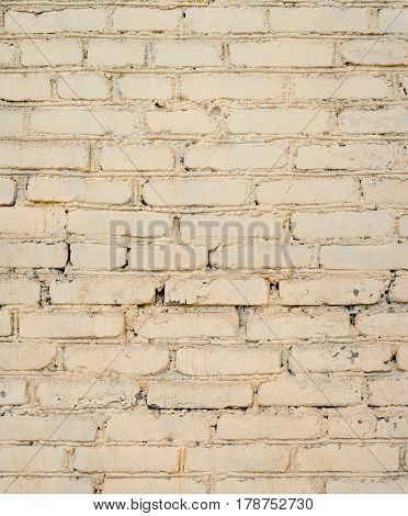 Background of old painted brick wall. Old bright brick wall texture. Brick wall painted in white