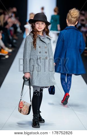 MOSCOW RUSSIA - MARCH 15 2017: Model walk runway for ALISIA FIORI catwalk at Fall-Winter 2017-2018 at Mercedes-Benz Fashion Week Russia. Kid's fashion. Fashion Time Designers.